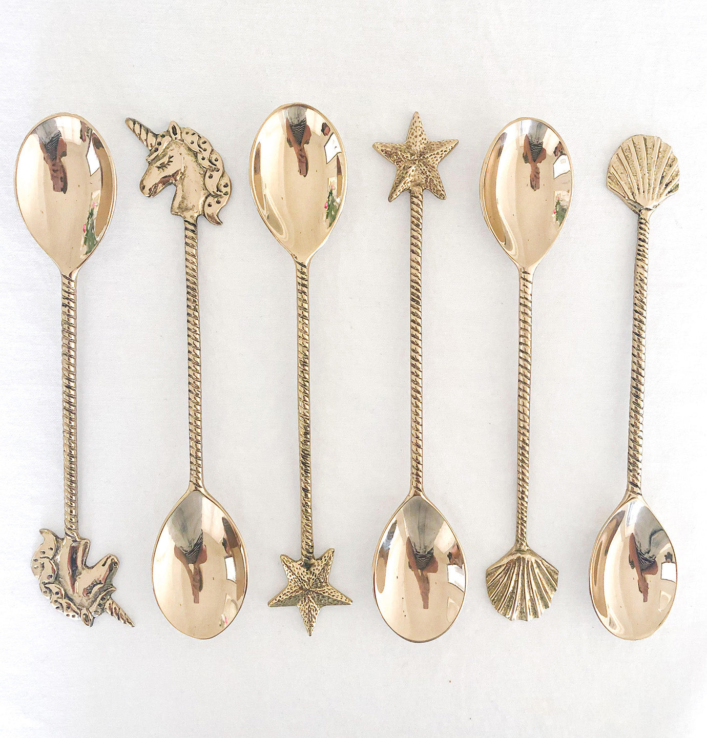 brass gold spoons